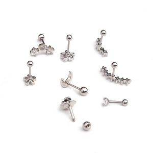 Set of silver stainless steel screw back ear studs with flower, star and zircon patterns