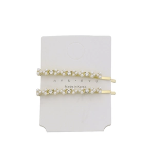 Set of two gold floral hair clips with white pearls and sparkling rhinestones