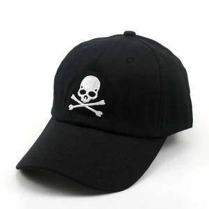 Black baseball cap with white skull embroidery in a profile view for outdoor leisure