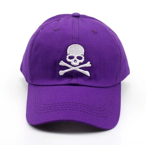 Close-up of purple cotton baseball cap featuring white skull and crossbones embroidery