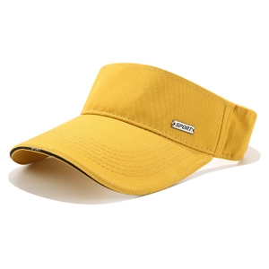 Close-up of the silver metal Sport badge and fabric texture on a yellow visor hat