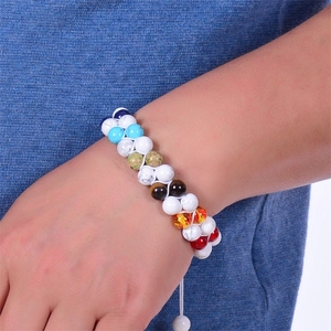 Detail of double-layer woven bracelet with natural turquoise and colorful stone beads