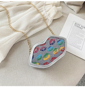 Macro detail of colorful glitter lip prints on silver crossbody bag for children