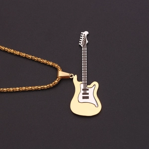 Close-up detail of golden electric guitar pendant necklace with enamel finish and box chain