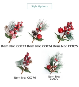 Various artificial Christmas pine picks with red berries, pine cones and snow finish