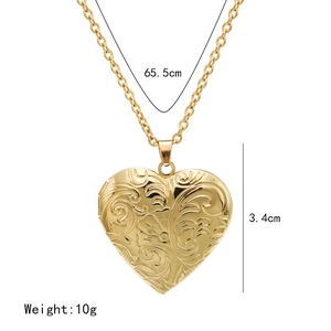 Detailed view of golden heart locket pendant showing 3.4cm height and 65.5cm chain length