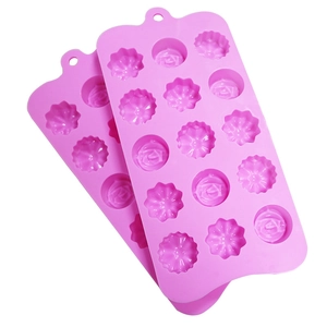 Close-up of a 15-cavity purple silicone mold showing detailed flower and rose shapes