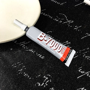 Macro shot of B-7000 transparent jewelry adhesive 15ml bottle on professional tray