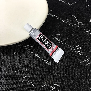 3ml B-7000 clear multi-purpose jewelry glue for rhinestone repair on a dark surface