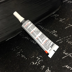 Macro view of ZHAN LIDA B-7000 adhesive tube for jewelry and rhinestone repair