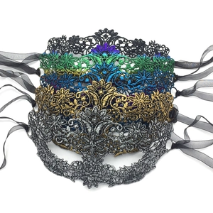 Detailed embroidery texture on colorful lace masquerade masks with gold foil accents