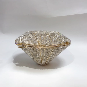 Detailed close-up of diamond-shaped clutch with sparkling hand-set crystals and gold trim