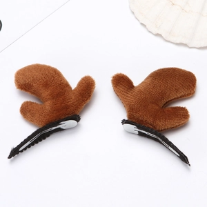 Detail of plush brown reindeer antler hair clips with metal BB clips for holiday styling