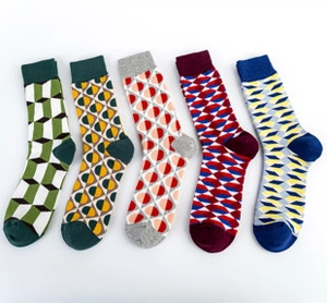 Detailed flat lay of five mid-calf socks with colorful geometric patterns on white background