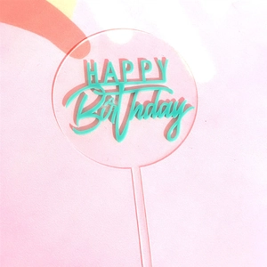 Detailed view of mint green acrylic Happy Birthday cake topper with transparent frame