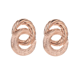 Detail of rose gold intertwined rings earring showing brushed and twisted textures