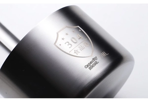 Detail of 304 stainless steel funnel with laser etched food grade logo and 500ml scale
