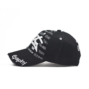 Black hip hop baseball cap with white 3D letter embroidery and all-over graphic print