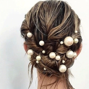 Elegant bridal pearl U-shaped hair pins set in a sophisticated hairstyle braid