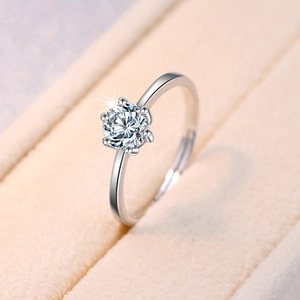 Macro shot of minimalist six-prong setting engagement ring with round cubic zirconia stone