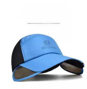 Detail of the blue baseball cap showing breathable side mesh and retractable sun visor wings