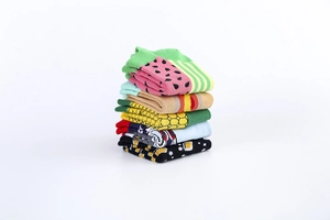 Close-up of five pairs of stacked cotton crew socks featuring vibrant watermelon and stripe patterns
