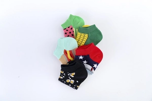 Flat lay of five cotton ankle socks featuring watermelon, corn, and hot dog patterns