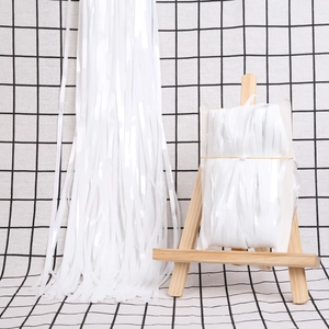 White macaron tinsel fringe curtain for party wall decoration in a variant bundle pack