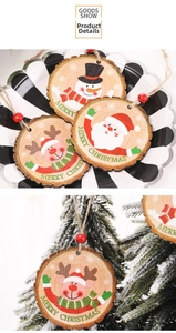 Detail of wooden Merry Christmas ornaments with painted Santa and reindeer on snowy tree