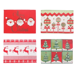 Set of four Christmas table placemats with Santa Claus, reindeer, and festive tree patterns
