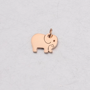 Macro shot of rose gold elephant pendant with polished finish and connector ring
