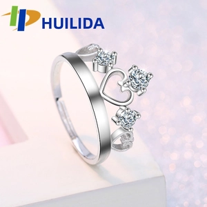 Detail of silver crown ring with heart cutout design and sparkling round cubic zirconia