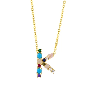 Detailed close-up of capital letter K pendant with vibrant multicolored zircon stones