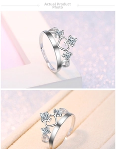 Macro detail of crown shaped silver ring with heart elements and sparkling cubic zirconia