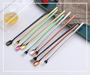 Detailed collection of long-handled stainless steel bar spoons and cocktail forks in assorted colors