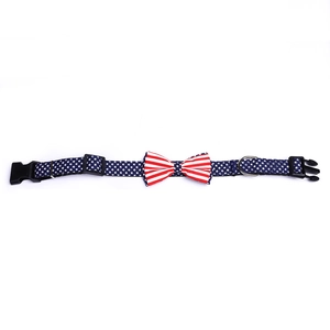 Detail of adjustable pet collar with American flag bow and durable plastic buckle clip