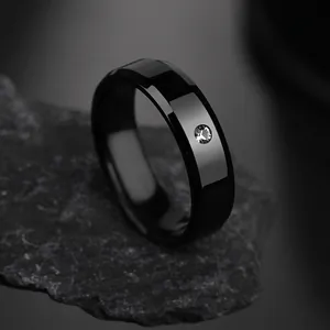 Minimalist 6mm black stainless steel ring with a single center-set clear zircon stone