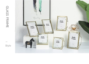 Close-up of geometric gold metal glass frames with various sizes and stable supports