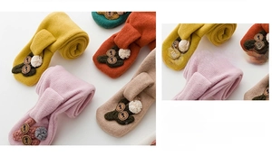 Close-up of colorful plush brooches and 3D fabric patches for socks and apparel accessories