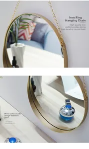 Detail of elegant gold iron hanging chain and HD glass for round bathroom mirror