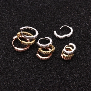 Detailed view of micro-pave zircon hoop earrings in silver, gold, and rose gold finishes