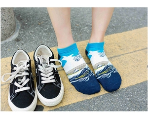 Detailed view of Ukiyo-e wave art pattern on low-cut cotton socks for women