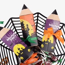 Macro detail of pencil-shaped Halloween party gift boxes with ribbons in a spiderweb basket