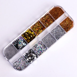 Top view of 12-grid organizer box with assorted colorful nail glitter and sequins