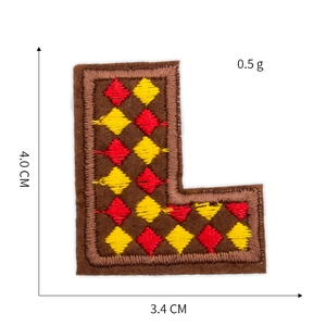 Detailed embroidery patch letter L with red and yellow diamond pattern for garments
