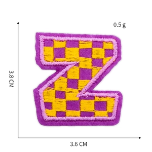 Detailed view of purple and yellow plaid letter Z embroidery patch with size dimensions