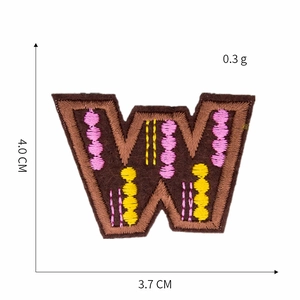 Detailed view of brown letter W embroidery patch with size dimensions 4.0cm x 3.7cm