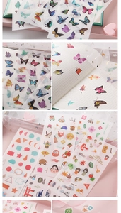 Detailed view of washi paper stickers with butterfly and floral patterns for scrapbooking