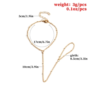 Détail d'un bracelet bague doré avec chaîne à billes et dimensions indiquées