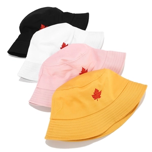 Set of four canvas bucket hats in black white pink yellow with red leaf embroidery